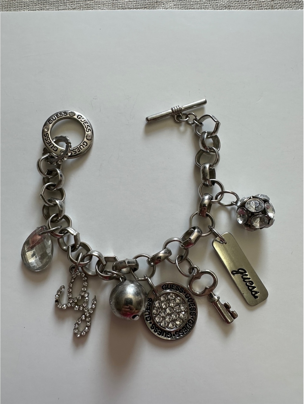GUESS Silver Tone Crystal Rhinestone Charm Bracelet Toggle Y2K 7.5” Logo